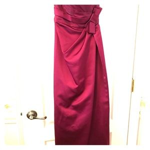 Plum colored, strapless prom/formal gown.